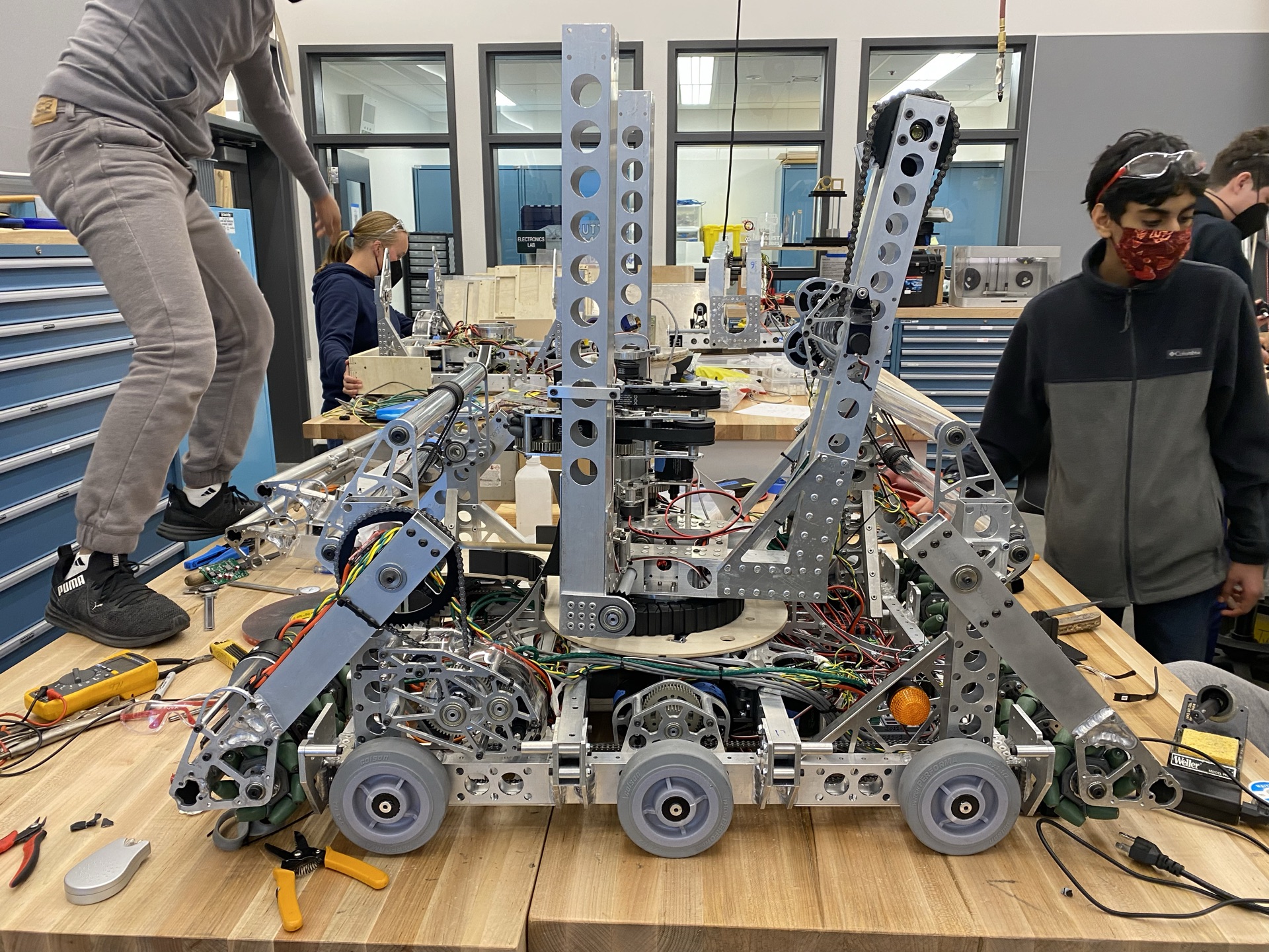 The 2022 robot half assembled on the shop table.
