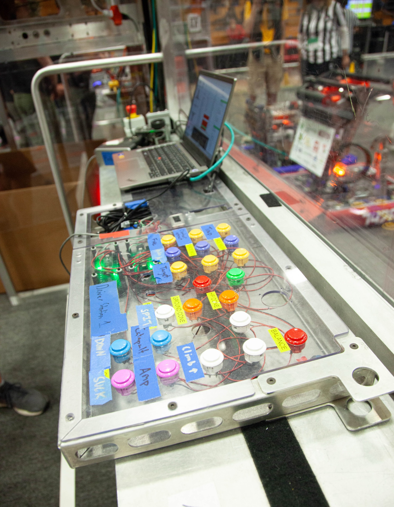 The button board from our driver station. One arcade button for everything the robot can do.