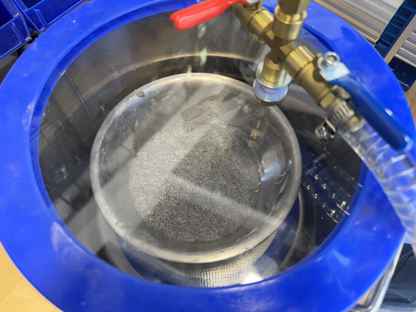 Pulling a vacuum on the propellant to remove air bubbles.