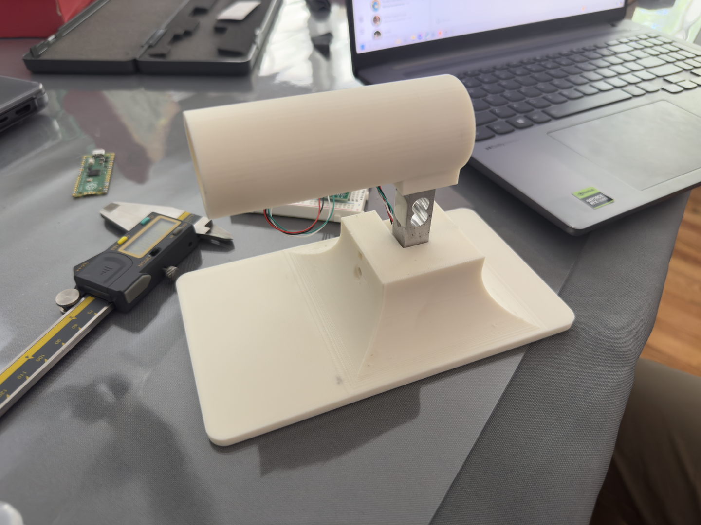 Custom-built thrust stand for measuring rocket motor performance.