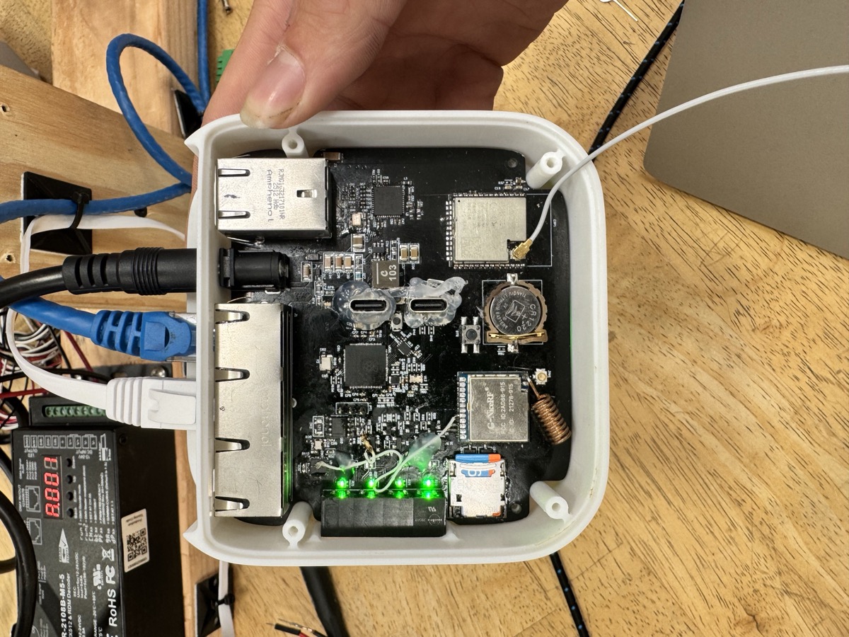 Interior view of the base station showing the complex PCB layout and component arrangement for coordinating all room devices.