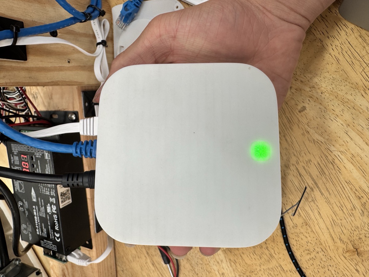 Top view of the base station PCB featuring RF communication modules, microcontroller, and power management circuitry.