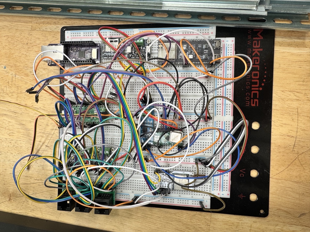 Early breadboard prototype of the base station used for initial circuit validation and firmware development.